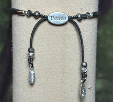 Load image into Gallery viewer, Charming Personal POWER Arm BAND-IT Black Faux Suede Cord Sparkling &quot;Peace&quot; Bird in Flight (Endings: &quot;Love/Adventure&quot;)